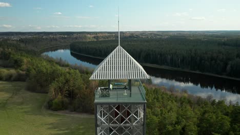 AERIAL:-Reveal-Shot-of-Birštonas-Observation-Tower-with-Nemunas-in-Background