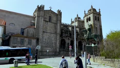 People-and-tourist-walking-near-Se-in-Porto,-Portugal