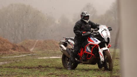 Slow-Motion-Motorbike-Lost-Traction-in-Mud-Rain-Foggy-Forest,-Off-Road-Extreme-Sport-Bike-Burnout,-Motorcycle-Difficulties-Movement-Suffers