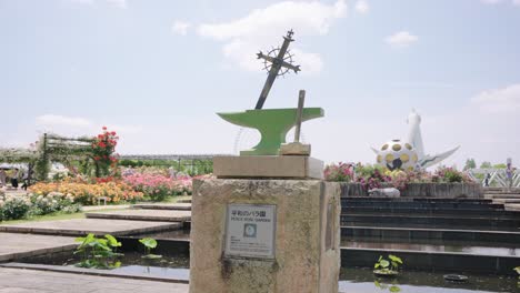 Osaka-Expo-Park,-Peace-Memorial-Statue-and-Rose-Garden-on-Warm-Sunny-Day