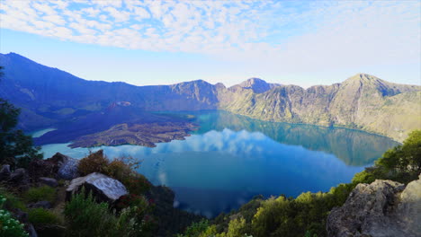 Volcanic-Lake-top-of-Mt-Ranjani-Lombok-Indonesia-Bali-Timelapse-peaceful-sunrise-cloud-passing-by-wide-mountain-scape-Volcano