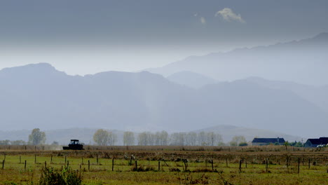 WIDE,-SILHOUETTE---A-tractor-sowing-seeds-during-the-drought