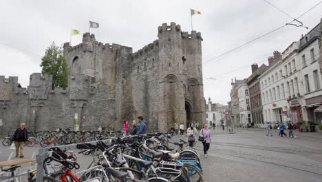 Wide-angle-view-of-people-along-the-the-Castle-of-the-Counts-in-Ghent,-Belgium