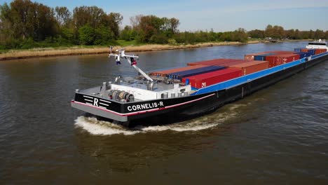 Aerial-Close-Up-From-Forward-Bow-Of-Cornelis-R-Cargo-Ship-Approaching-Along-Oude-Maas-On-18-April-2022