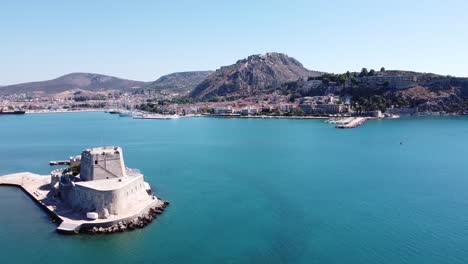 Bourtzi-Fortress-and-Nafplio-Cityscape-in-Peloponnese,-Greece---Aerial