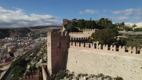 Moorish-fortified-walls-from-Alcabaza-of-Almería,-Aerial-Pullback