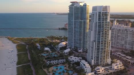 Aerial-view-of-the-Continuum-towers-on-South-Beach,-sunset-in-Miami,-USA---circling,-drone-shot