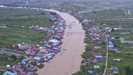 Sungai-Martapura-river-in-rural-South-Kalimantan,-aerial