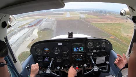 Skilled-Flight-Instructor-Teaching-Aspiring-Aviator-Safe-Landing-Technique-Of-The-Airplane