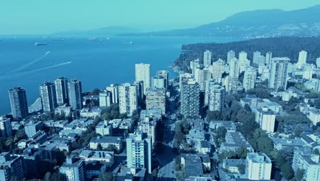 Vancouver-Downtown-Davie-Village-aerial-flyover-motor-boats-racing-in-the-harbor-overlooking-English-Bay-Stanley-Park-most-popular-apartments-right-by-the-beaches-in-the-mountain-valley-city2-3