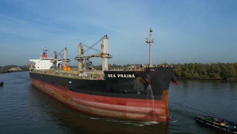 Vessel-Sea-Prajna-Bulk-Carrier-Over-Oude-Maas-Near-Puttershoek-Harbour,-Netherlands