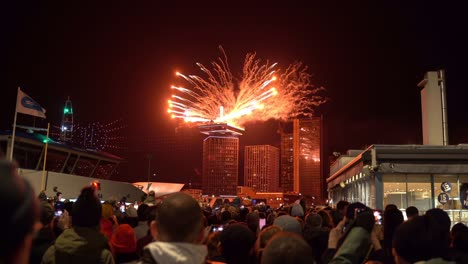 Celebratory-bright-colourful-fireworks-over-Amsterdam-Central-Station-on-New-Year's-Eve