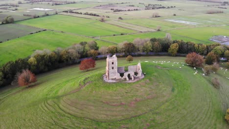 Aerial-Parallax-shot-of-Burrow-Mump-in-Somerset-England-with-fields-in-the-background