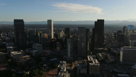 Backwards-drone-dolley-shot-of-high-buildings-in-the-city-center-of-Denver