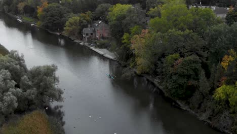 Drone-flying-over-a-Mississauga-river-with-kayakers-paddling