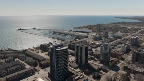 View-from-a-drone-of-apartment-buildings-and-small-shops-on-the-lakeshore-of-Lake-Ontario-in-Mississauga