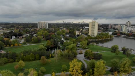 Drone-flying-over-lakeshore-park-on-an-overcast-summer-day