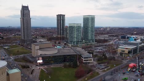 Rainy-and-foggy-view-from-a-drone-flying-through-downtown-Mississauga-on-a-summer-day