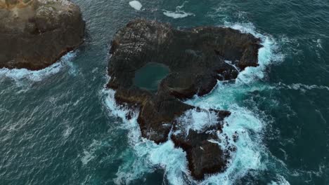 Orbiting-aerial-shot-of-an-isolated-seabird-habitat-in-the-Pacific-Ocean