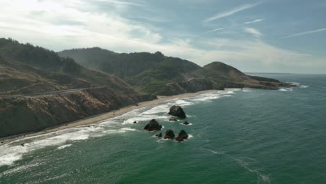 Drone-shot-of-California's-hazy-coastline-at-midday