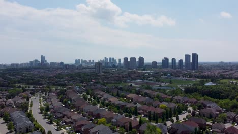 Drone-flying-towards-downtown-Mississauga-on-hazy-day-in-summer