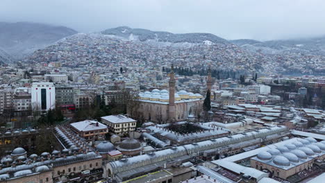 Grand-Mosque-of-Bursa-With-Cityscape-Background-During-Winter-In-Bursa,-Turkiye