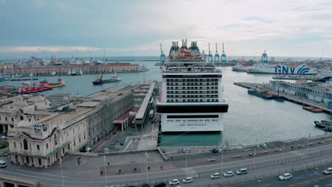 MSC-Bellissima-cruise-ship-docked-at-terminal-in-port-of-Genoa,-Italy