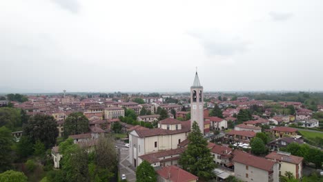 Establisher-aerial-of-Capriate-San-Gervasio-town-with-view-of-Church-tower