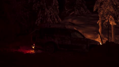 Side-View-Of-A-Snowy-Car-Parked-In-The-Dark-At-Night-In-Winter