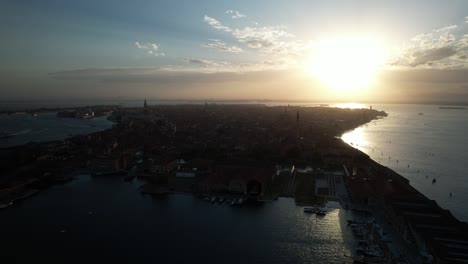 Sunrise-in-Venice-Italy,-Aerial-Drone-Above-City-of-Canals,-Island-Silhouette-at-Coastal-Sea,-Panoramic-Open-Wide-Sky-Horizon,-European-Travel-and-Tourism