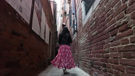 Rear-View-Of-A-Female-South-Asian-On-Alleyways-In-Venice,-Italy
