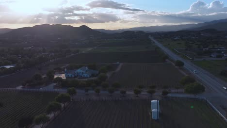 Grape-vineyard-and-countryside-farmland-at-sunset---ascending-aerial-hyper-lapse