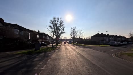 13-February-2023---POV-Driving-Along-Kings-Road-In-Harrow-With-Sun-Against-Blue-Skies