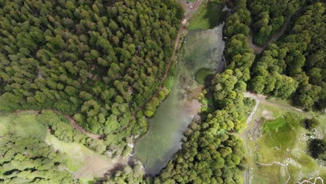 Drone-video-alpine-lake-passing-overhead-Moutsalia-mountain-Gramos-summer