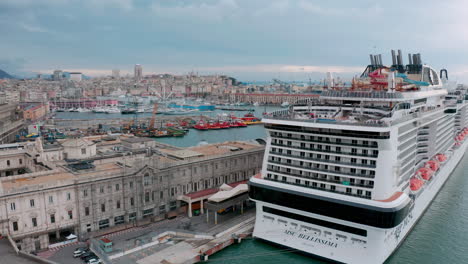 Aerial-of-MSC-Bellissima-luxury-cruise-ship-docked-at-MSC-terminal-in-Genoa