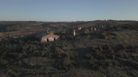 Sao-Domingos-Mine-in-Portugal,-drone-aerial-view-of-old-buildings-or-ruins-around
