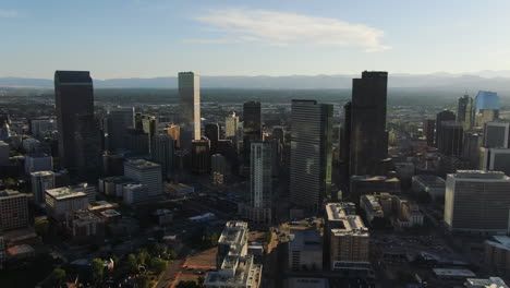 Backwards-drone-dolley-shot-of-the-modern-skyline-of-Denver-on-a-sunny-day