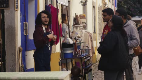 Street-vendor-at-a-stall-offering-goods-to-people-on-the-street