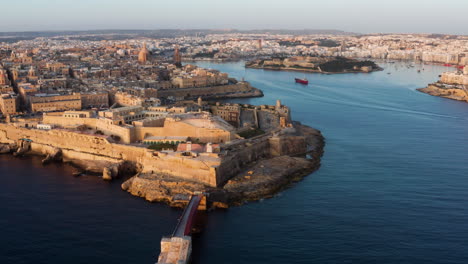 Aerial-View-Over-Walled-City-Of-Valletta-At-Sunset-In-Malta---drone-shot