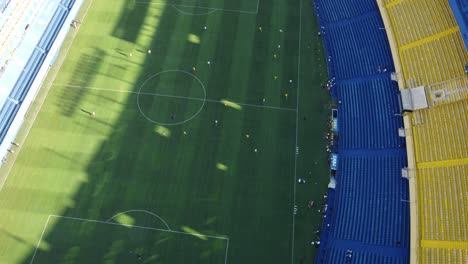 Aerial-birds-eye-shot-of-professional-soccer-player-during-session-in-Bombonera-Stadium-of-Boca-Juniors