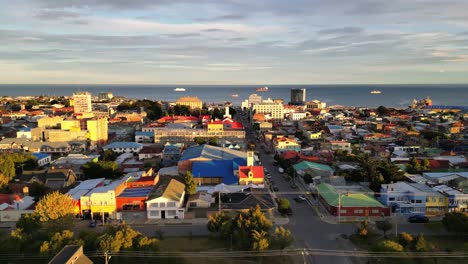 Aerial-Drone-Fly-Above-Punta-Arenas-Chile-Urban-City-Area,-Sea-Port-Oceanic-Blue-Skyline-Water,-Gateway-Port-in-Patagonian-Peninsula
