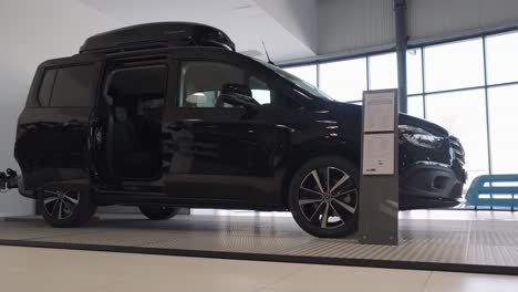 Beautiful-new-black-Marcedes-electric-van-standing-in-the-showroom-slow-motion-view
