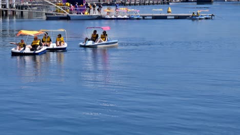 Editorial-illustrative-view-of-the-rental-pedal-boats-at-Darling-Harbour-in-Cockle-Bay,-Sydney,-near-the-National-Maritime-Museum