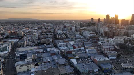 Downtown-Los-Angeles-establishing-city-skyline-at-sunset---cinematic-aerial-view
