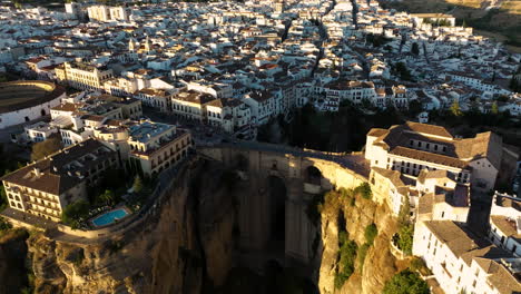 Aerial-View-Of-The-Historic-Town-Of-Ronda-At-Sunset,-Andalucia,-Spain---drone-shot