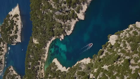 Yacht-in-beautiful-cove,-Calanques-de-Port-Pin,-Mediterranean-Sea