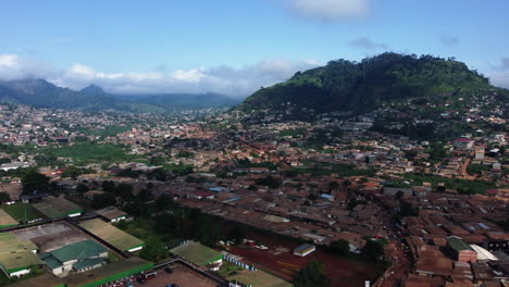 Aerial-overview-of-the-Etoug-Ebe-neighborhood-in-Yaounde,-Cameroon---tracking,-drone-shot