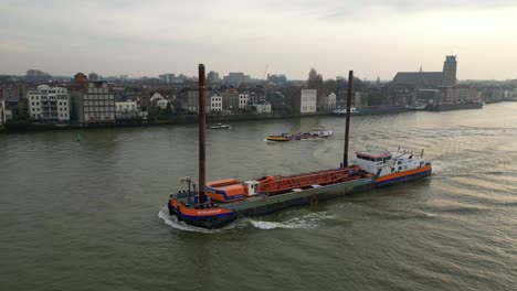 Dutch-Van-Oord-LNG-powered-crane-vessel-sailing-in-a-river-|-The-Werkendam