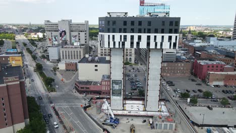 The-Exchange-tower---built-from-the-top-down-in-Detroit-city,-aerial-view