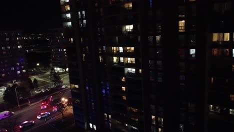 Firefighters-on-scene-of-fire-shine-torches-inside-apartment-room